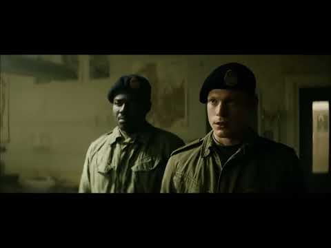 '71 U.S. trailer frame: dim corridor, soldier catching breath
