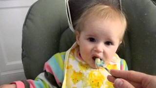 Funny sour face baby gagging on tart apples video