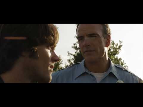 Friday the 13th (2009) trailer frame with Jason emerging from the woods, backlit by moonlight
