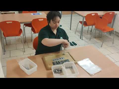 An SCB expert demonstrates compiling a Heavy Duty Fixings Bag ready for sealing.