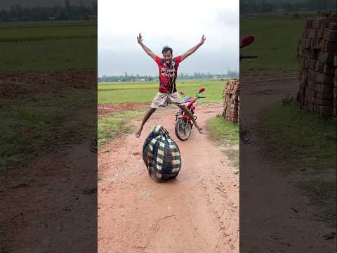 Jumping in a lungi in front of a motorcycle,,30