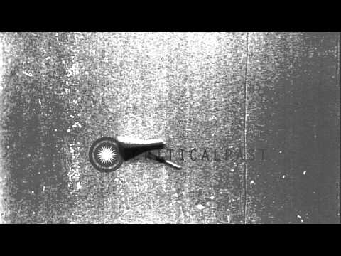 The testing of the parachute mechanism of a capsule during Project Mercury at a t...HD Stock Footage