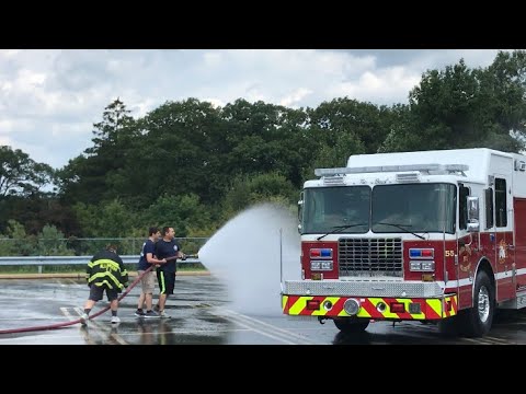 Allamuchy Firefighters spraying down Budd Lake’s new rescue truck