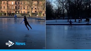 Ice skaters hit frozen boating pond to show off skills
