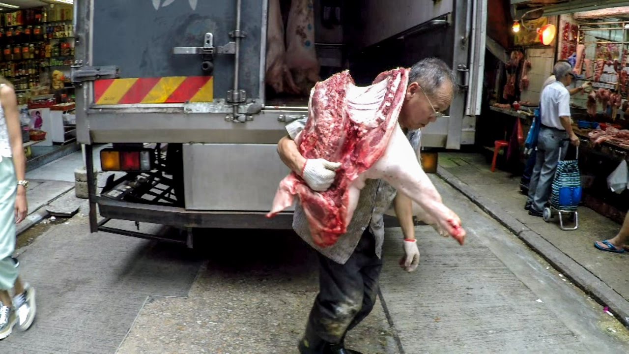 See colourful fruits, vegetables and seafood sold in old-style stalls.