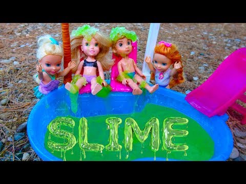 Elsa and Anna toddlers slime in the pool