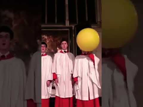 Choir boy using helium balloon