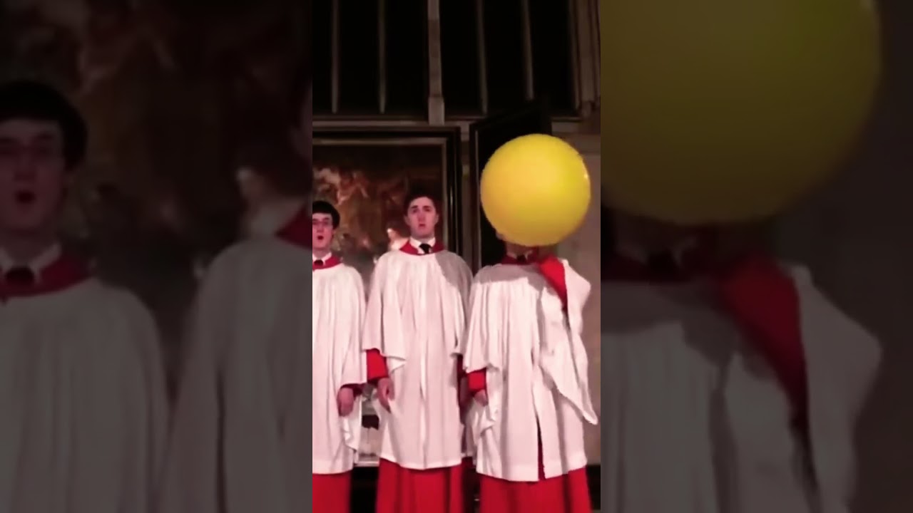 Choir boy using helium balloon