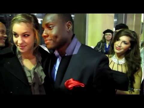 Dayo Okeniyi of The Hunger Games greets fans at The Vow premiere in Hollywood