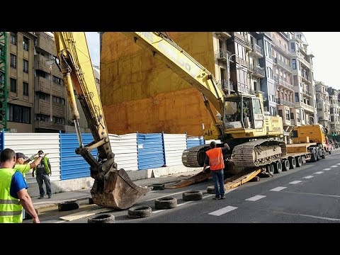 EXCAVATOR drops from TRUCK and 6 year old man drives it and makes holes