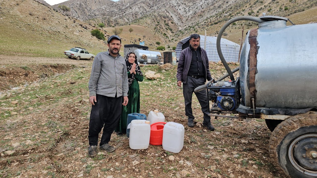 In the heart of the mountains; bringing water and two barrels is a sign of continuing life