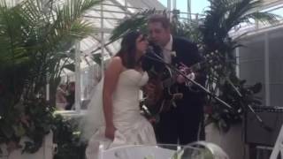 Zach and Mikah singing at wedding