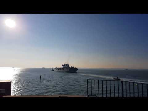 Hms Ocean sailing from Portsmouth into the distance