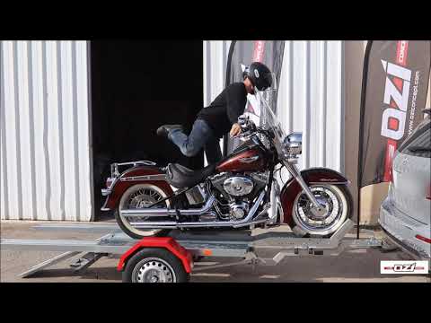 FOLDING MOTORCYCLE TRAILER LOADED IN THE BACK OF YOUR CAR
