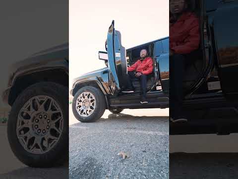 Three windshield wipers and four-wheel steering. That's a Hummer EV