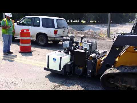 RoadHog RH2460 Milling Railroad Crossing Prior to Overlay Repair