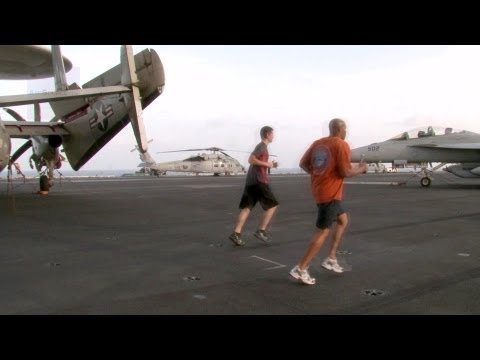 Aircraft Carrier USS George H. W. Bush Sailors Running on the Flight Deck