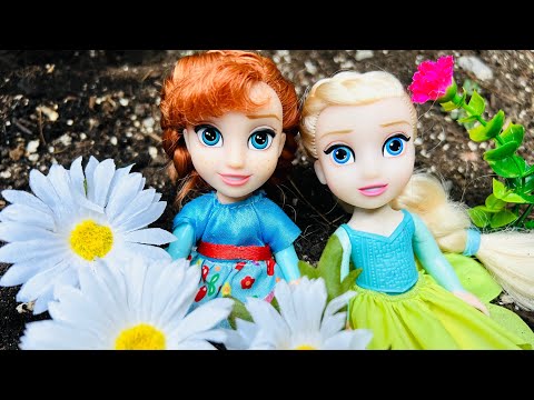 SPRING MAGIC FLOWERS ! Elsa & Anna toddlers planting with BARBIE - fun outdoors - Barbie dolls