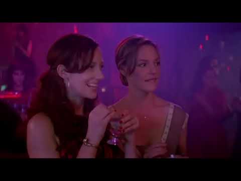 27 Dresses trailer still: Katherine Heigl in a white dress with pink title typography