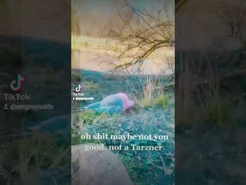 Tarzaner girl swinging from tree