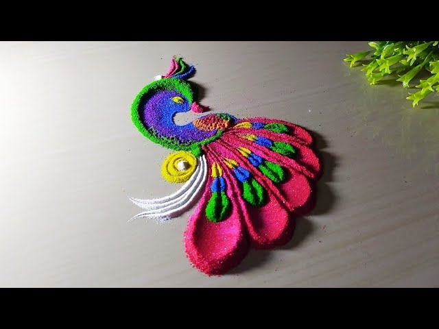 Most beautiful and easy peacock rangoli design by shubh aangan
