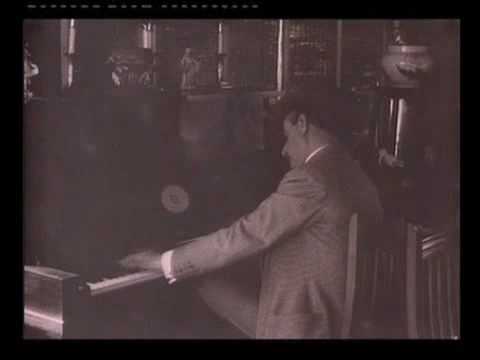 Giacomo Puccini playing piano