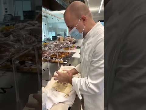 Measuring the pH of sourdough starter before kneading a panettone