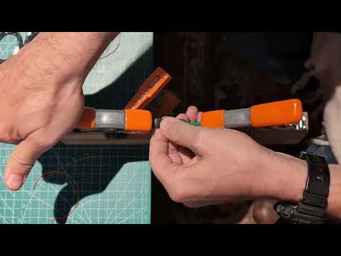 Attaching slingshot pouch to bands with constrictor knot.