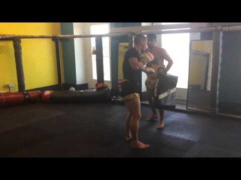 Lionheart trainer Tony smashing the lowkick pad