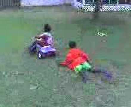 Big brother gives little sis a push (Video_060107_004.3gp)