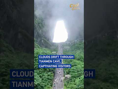 Clouds drift through Tianmen Cave, captivating visitors #coolchina