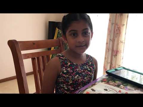 Akshaya writing the Arabic Alohabet