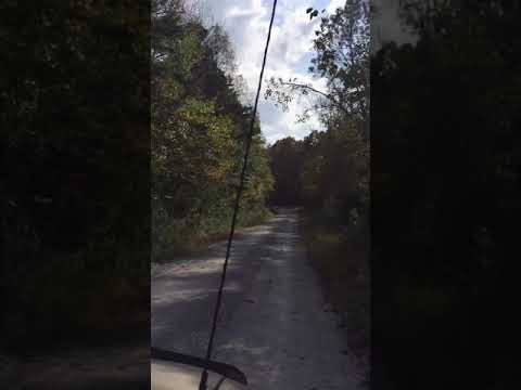 time-lapse through land between the lakes down to one of the lakes.