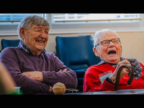Still from the Essex Dementia Care promotional film showing two residents laughing