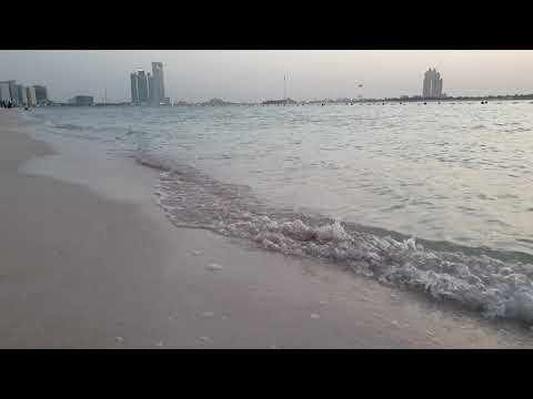 Abu Dhabi corniche beach - Shore waves slow motion