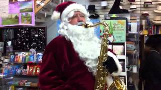 Santa Claus plays the sax at Soave Faire in Saratoga