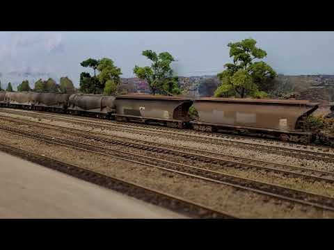Ho scale Pacific Nationals 8178, 48142, 8257 pull the cement and sugar train.