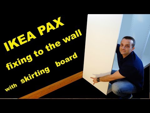 Part of a video titled IKEA PAX wardrobe fixing to the wall (with skirting board) - YouTube