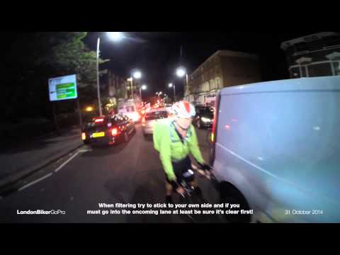 Silly Cyclist - Filtering through a blind spot on the wrong side of the road...