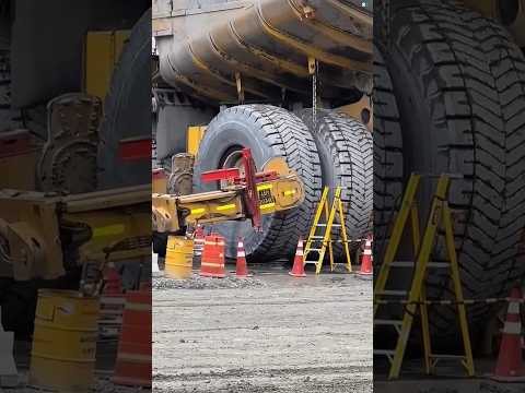 Why Do Mining Trucks Have Chains Between Their Tires? #facts #ytshorts #trending