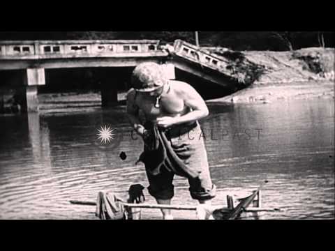 United States troops advance through trees in a wooded area, Okinawa, Pacific The...HD Stock Footage