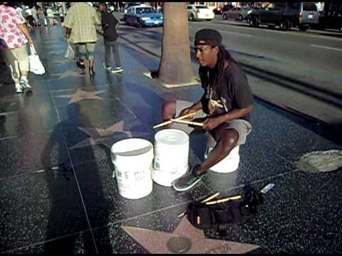 Smiling bucket drummer in Hollywood