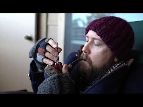 A man relaxes and smokes Early Morning Pipe tobacco early in the morning