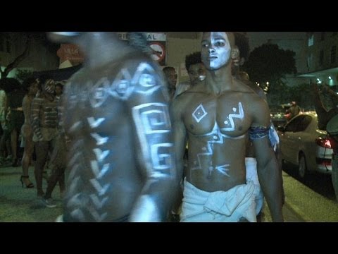Protesters call for more black models on the catwalks of Rio