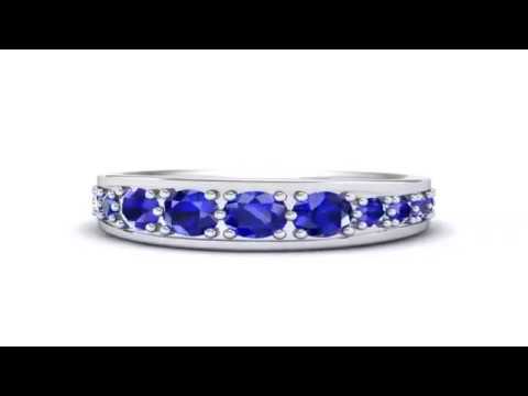 DIAMOND RINGS | Round Brilliant Tapered Blue Sapphire Eternity Ring | By Iconic Jewelry