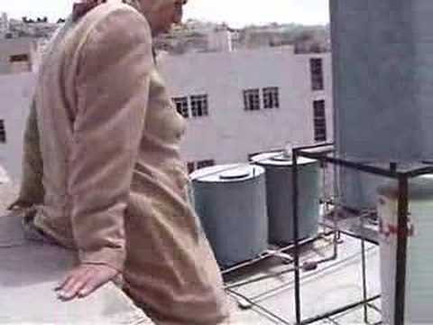 A clip from B’tselem showing Shuhada Street and how residents have to climb over rooftops to reach their houses
