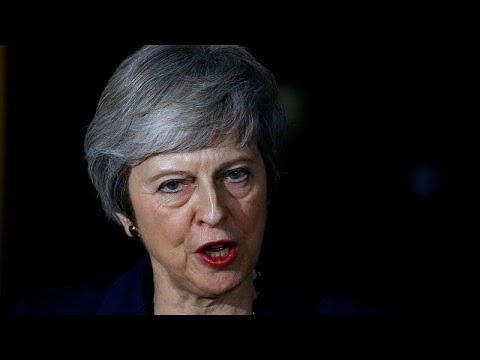 May survives first Brexit hurdle as Brussels publishes draft deal