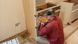Episode 222: Kitchen cabinets — Installing the refrigerator side panels and the first base cabinet