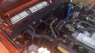 Testing oil pressure with manual gauge, V12 Jaguar, 1982