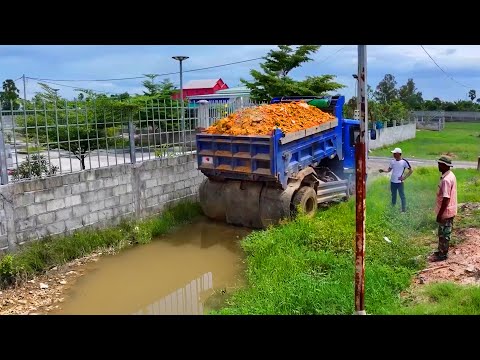 landfill complete project . truck transport soil , bulldozer push soil building house